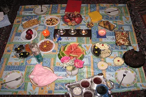 A table cloth with a variety of Yalda favorites taken 