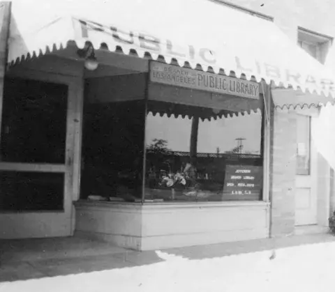 Exterior view of Jefferson Branch of the Los Angeles Public Library. Branch rented a store building at 2065 West Jefferson Boulevard, between 1915-1923. View is of the storefront of the library. 