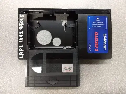 Photo of VHS-C sliding into adapter
