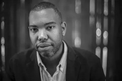 Black and white headshot of author Ta-Nehisi Coates