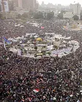 enoumous gathering of people in a city square as seen from above