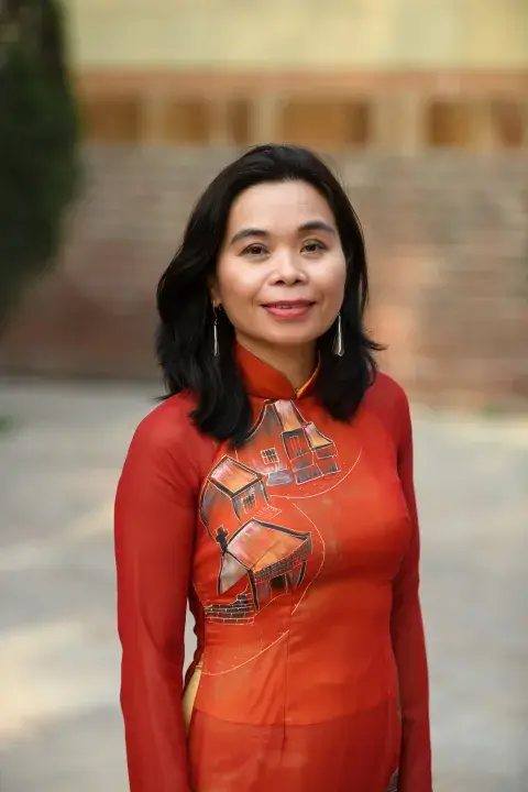 author and poet Nguyễn Phan Quế Mai in a red dress