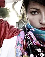 Ana Tijoux wearing a colorful scarf