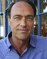 Sandy Tolan in a blue shirt
