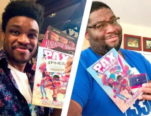 Authors Rashad Doucet and Jason Reeves holding up their book Pax Sampson