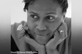 Poet Janice Harrington with her head in her hands