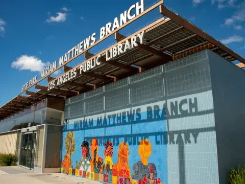 A colorful mural on the exterior of Miriam Matthews Branch library