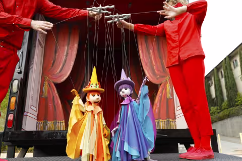 2 bob baker puppets with their puppetiers