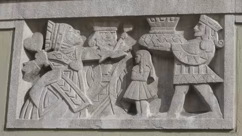 Relief panels depicting Alice and the Red Queen