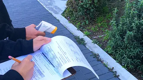 teens participating in a urban heat island effect exercise by the Robertson Branch Library