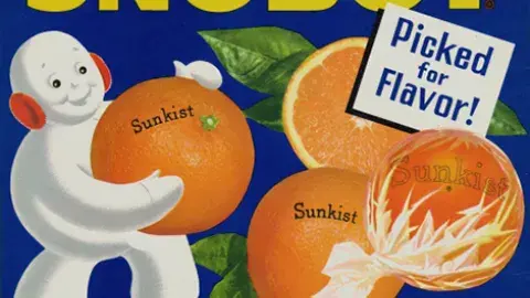 Snowman carrying giant oranges