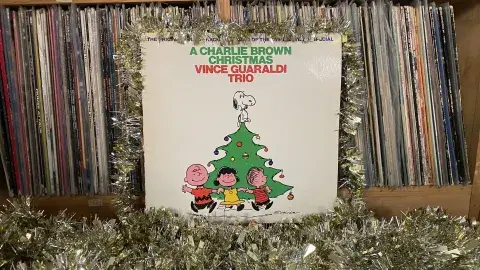 A Charlie Brown Christmas album cover with tinsel decoration
