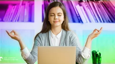Young girl facing her laptop in a stress-free pose
