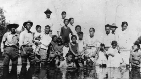 Korean American family at river, ca 1900