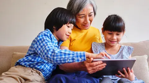 Grandma and kids reading together