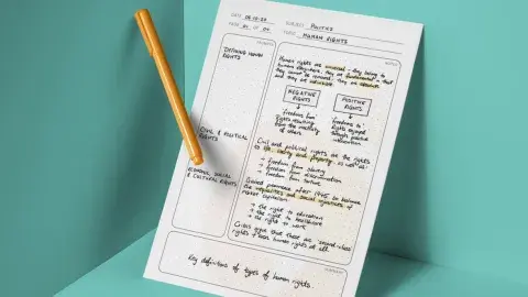 notes and a pencil in a teal colored box