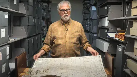 Glen Creason holding map