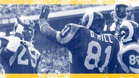 Left to right: Ram's player Eric Dickerson (#29), and David Hill (#81) give each other a "high-five" at the end of a winning game.