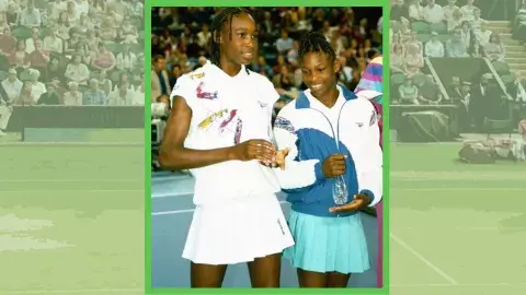 Serena and Venus Williams in 1993 with a tennis court behind them