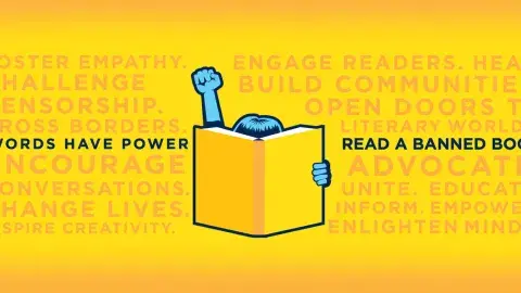 yellow banner with a blue fist in the air behind an open book