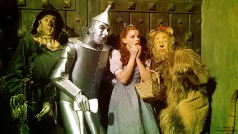 Lobby card from the original 1939 release of The Wizard of Oz featuring Judy Garland, Ray Bolger, Jack Haley and Bert Lahr