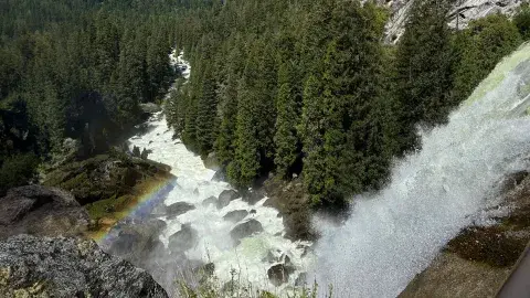waterfall down a deep ravine in the mountains