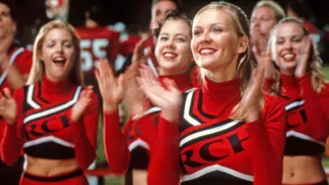 Cheerleaders in red outfits