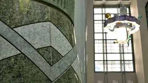 Central Library Atrium. Detail of the chevron design motif at the base of a column.