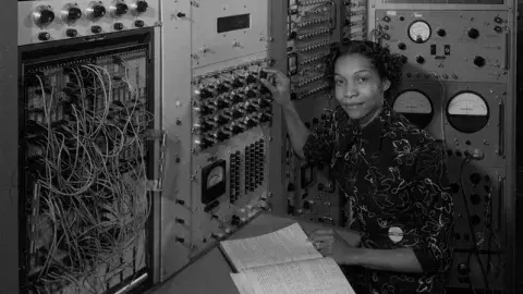 woman in front of phone operator board
