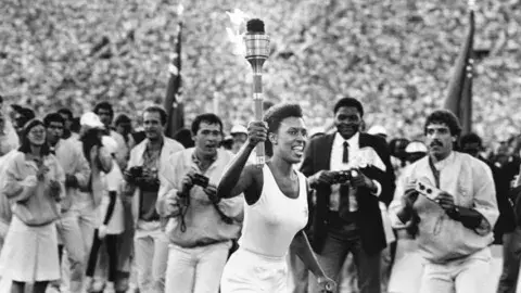 Gina Hemphill running with the olympic torch