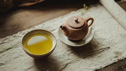 cup of tea and teapot on a table 