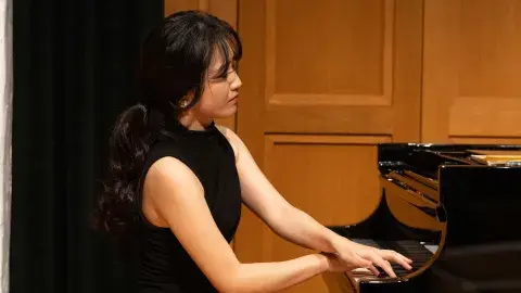 Hyewon Chang playing piano