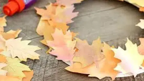 a wreath made of brown and orange autumn leaves