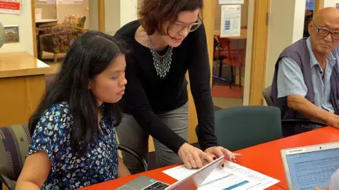 Tutor working with learner 