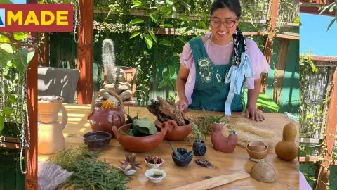 a women displaying clay sculptures