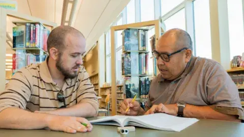 Adult Literacy tutor and learner having a session
