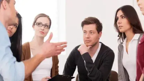 Men and women in discussion