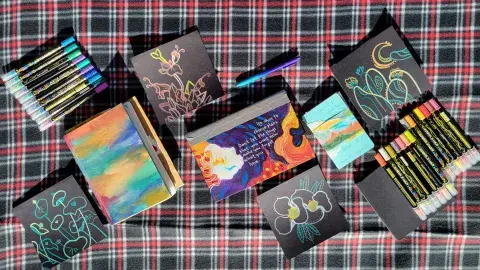 Photos of journals and coloring materials. 