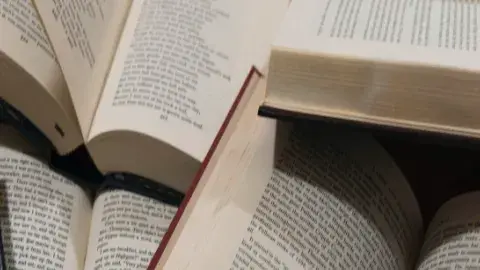 several open books with text