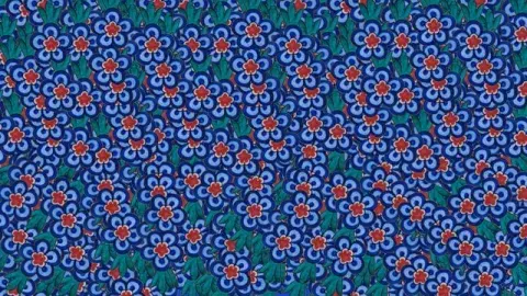 pattern of blue and red flowers on green background