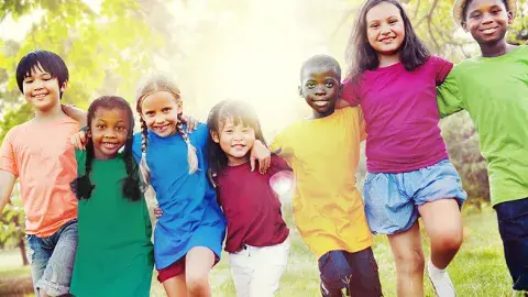 Children of different ages are happy together outdoors