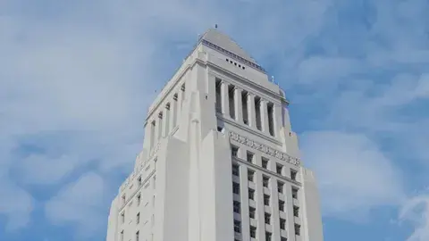 Top of Los Angeles City Hall against blue sky