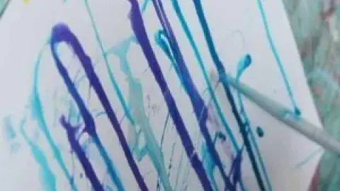 dripping paint on a canvas