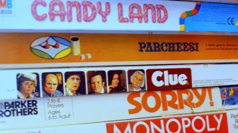 Children's Candy Land, Clue, Sorry, and Monopoly board games.