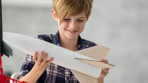 girl holding space shuttle