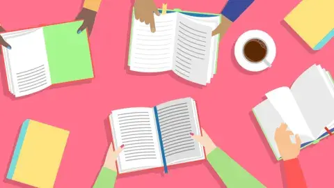 books open on pink table