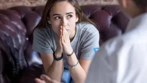 teen girl looking concerned