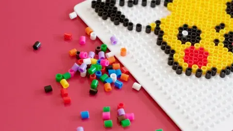 a half finished pikachu is shown on a fuse peg board