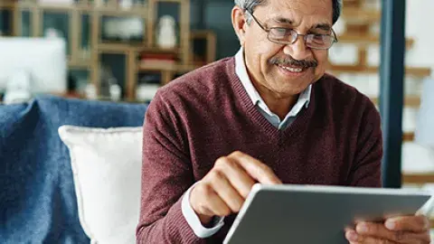 person holds tablet