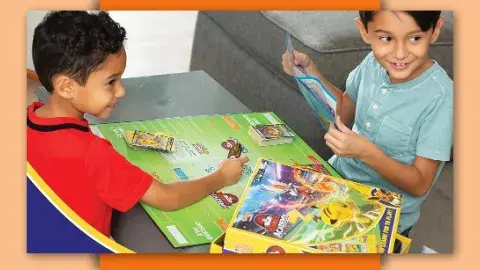 Two kids playing Pokemon 